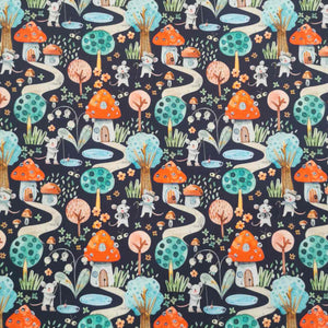 Flat lay of pure cotton poplin in a toadstool house design. Available at Minerva's Bower 