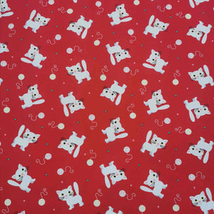 Flat lay of pure cotton poplin in a red yarn kitty design. Available at Minerva's Bower