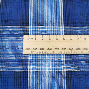 Flat lay of cotton ripple check. Made in Japan. Available at MInerva's Bower. Ruler included for scale