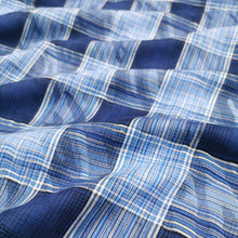 Load image into Gallery viewer, Flat lay of cotton ripple check. Made in Japan. Available at MInerva&#39;s Bower. Fabric draped to show how it handles