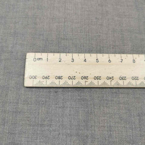 Flat lay of 100% Dutch Delave Linen, Bison, for sale at Minerva's Bower, close up with ruler included