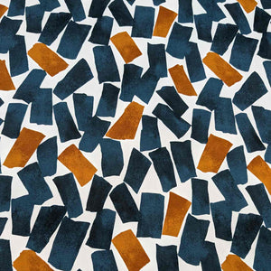 Flat lay of fine cotton, in a falling blocks design, in teal colourway. Made in Japan by Kokka. Available at Minerva's Bower