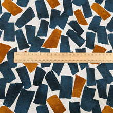 Load image into Gallery viewer, Flat lay of fine cotton, in a falling blocks design, in teal colourway. Made in Japan by Kokka. Available at Minerva&#39;s Bower. Ruler included for scale