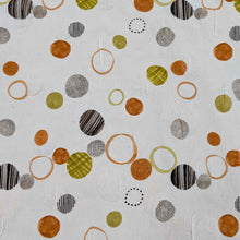 Load image into Gallery viewer, Flat lay of pure cotton seersucker in orange floating circles design. Made in Japan by Kokka. Available at MInerva&#39;s Bower