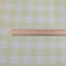 Load image into Gallery viewer, Flat lay of Gelato Check - lime linen cotton for sale at Minerva&#39;s Bower, with ruler for scale 