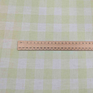 Flat lay of Gelato Check - lime linen cotton for sale at Minerva's Bower, with ruler for scale 