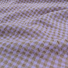 Load image into Gallery viewer, Gemma seersucker linen rayon blend, in lilac colourway. Available at Minerva&#39;s Bower. Fabric draped to show how it handles