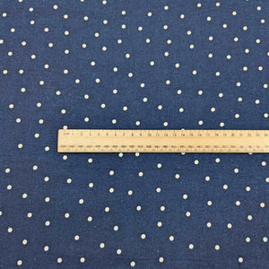Flat lay of cotton linen spot fabric, in navy colourway. Made in Japan, by Kokka. Available at Minerva's Bower. Ruler included for scale