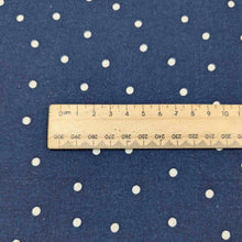 Load image into Gallery viewer, Flat lay of cotton linen spot fabric, in navy colourway. Made in Japan, by Kokka. Available at Minerva&#39;s Bower. Ruler included for scale