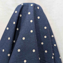 Load image into Gallery viewer, Flat lay of cotton linen spot fabric, in navy colourway. Made in Japan, by Kokka. Available at Minerva&#39;s Bower. Fabric draped to show how it handles