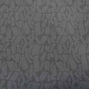 Textured black muno jacquard patterned fabric. Available at Minerva's Bower