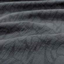 Load image into Gallery viewer, Close-up of textured black muno jacquard fabric with subtle pattern. Available at Minerva&#39;s Bower