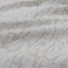 Load image into Gallery viewer, Close-up of textured cream muno jacquard fabric with a subtle pattern. Available at Minerva&#39;s Bower