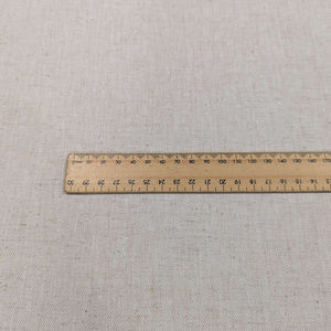 Flat lay of 100% midweight linen in natural oatmeal colour, for sale at Minerva's Bower
