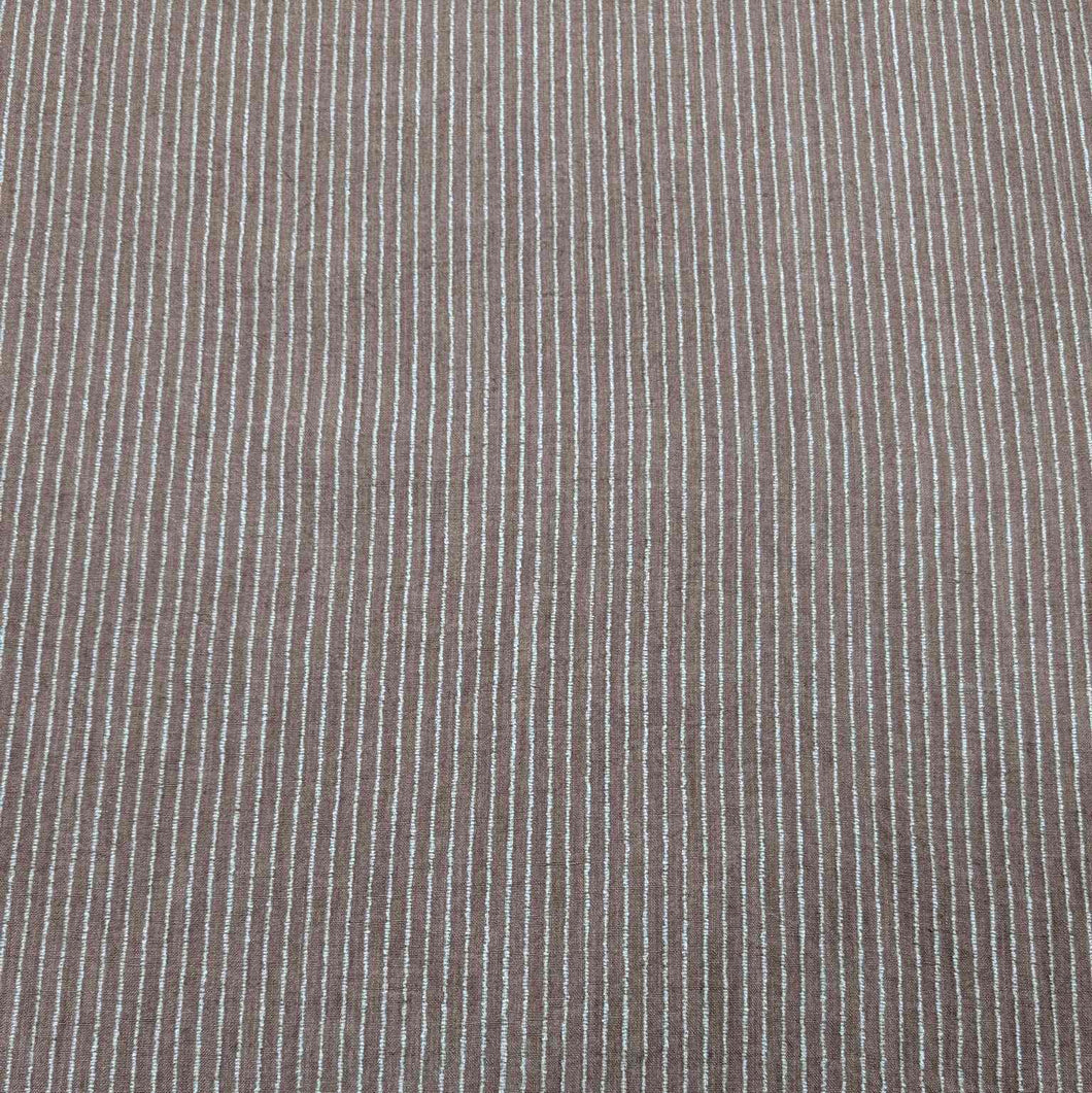 Close-up of brown fabric with thin white stripes. Available at Minerva's Bower