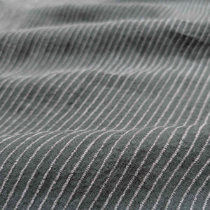 Close-up of textured fabric with subtle pattern. Available at Minerva's Bower