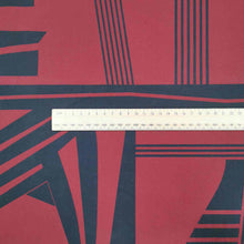 Load image into Gallery viewer, Metropolis is a dramatic, large scale graphic print. Pure cotton, with black on a claret red background, available at Minerva&#39;s Bower. Image includes a ruler for scale