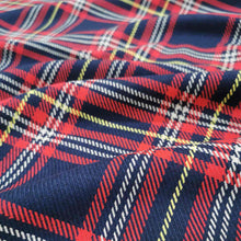 Load image into Gallery viewer, Chloe is a pure cotton tartan twill. A navy blue base, with lines of red, white and yellow, to create the plaid effect. Available at Minerva&#39;s Bower. Fabric is draped across bench