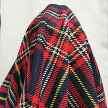 Load image into Gallery viewer, Chloe is a pure cotton tartan twill. A navy blue base, with lines of red, white and yellow, to create the plaid effect. Available at Minerva&#39;s Bower. Fabric is draped over roll