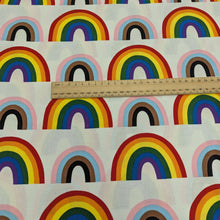 Load image into Gallery viewer, Alexander Henry cotton Fabric with rainbow pattern and a ruler for scale on a white background, for sale at Minerva&#39;s Bower