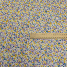 Load image into Gallery viewer, Japanese cotton fabric with a floral pattern with small flowers in purple, yellow and blue, with ruler included for scale, for sale at Minerva&#39;s Bower