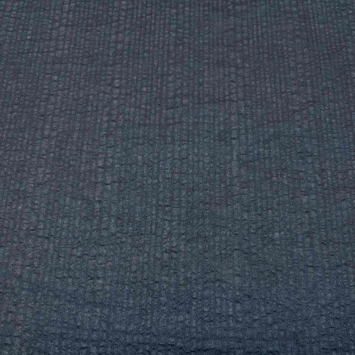 Flat lay of pure cotton voile seersucker self stripe, in black colourway. Available at Minerva's Bower