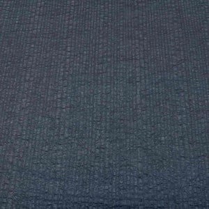 Flat lay of pure cotton voile seersucker self stripe, in black colourway. Available at Minerva's Bower