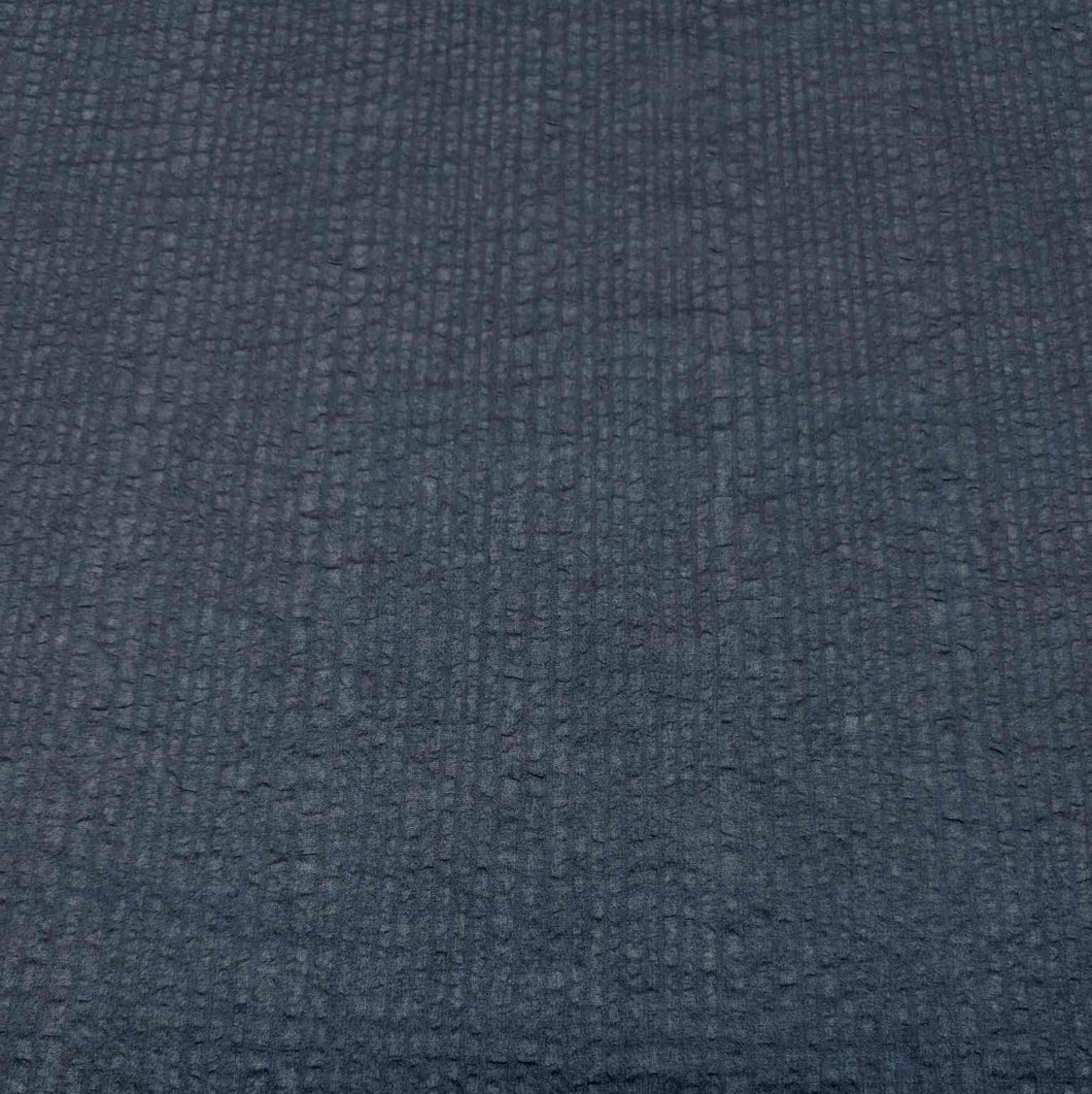 Flat lay of pure cotton voile seersucker self stripe, in black colourway. Available at Minerva's Bower