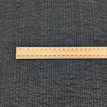 Load image into Gallery viewer, Flat lay of pure cotton voile seersucker self stripe, in black colourway. Available at Minerva&#39;s Bower. Ruler included for scale