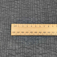 Load image into Gallery viewer, Flat lay of pure cotton voile seersucker self stripe, in black colourway. Available at Minerva&#39;s Bower. Ruler included for scale