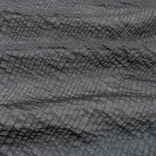 Load image into Gallery viewer, Flat lay of pure cotton voile seersucker self stripe, in black colourway. Available at Minerva&#39;s Bower. Fabric draped to show how it handles