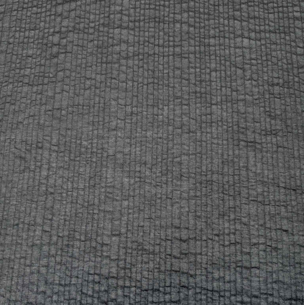 Flat lay of pure cotton seersucker self stripe, in navy colourway. Available at Minerva's Bower