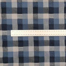 Load image into Gallery viewer, Shetland Check is a beautful yarn dyed linen cotton fabric. It is woven in tones of blues and taupe, and is available at Minerva&#39;s Bower. Image includes a ruler for scale