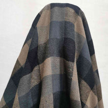 Load image into Gallery viewer, Shetland Check is a beautful yarn dyed linen cotton fabric. It is woven in tones of blues and taupe, and is available at Minerva&#39;s Bower. Fabric is draped over roll.