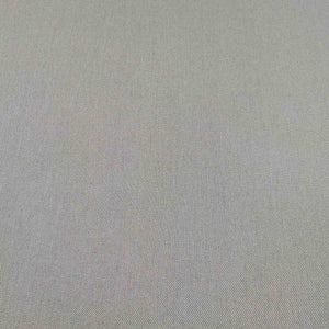Flat lay of washed cotton drill in taupe colourway. Available at Minerva's Bower