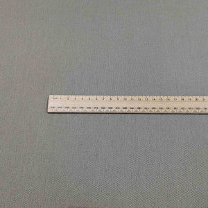 Flat lay of washed cotton drill in taupe colourway. Available at Minerva's Bower. Ruler included for scale