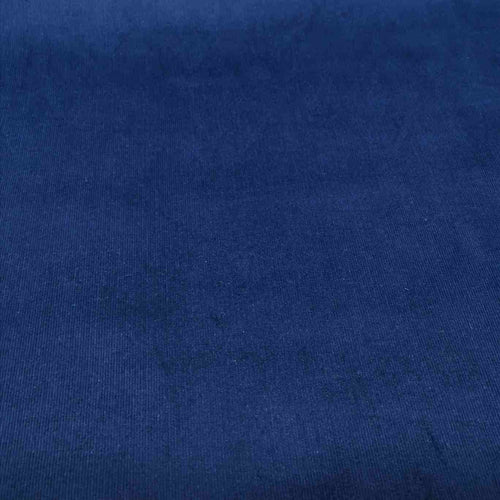 Flat lay of Dawn Pinwale Stretch Cotton Cord, Indigo, for sale at Minerva's Bower